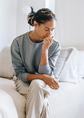 Woman Sitting On Couch