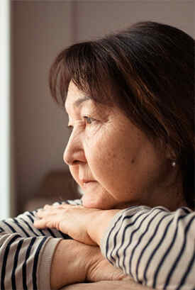 Woman Looking Out Window
