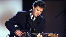 Vince Gill singing Go Rest High on That Mountain.”