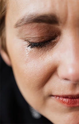 Woman shedding a tear