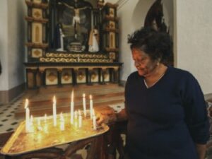 Woman Lighting Candles