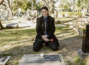 Man At Gravestone