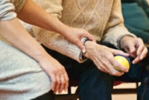 Hands of Caregiver with Patient