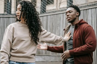 Woman Pushing Man Away