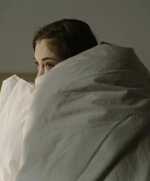 Woman Under Comforter