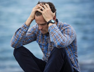 Man Holding Head