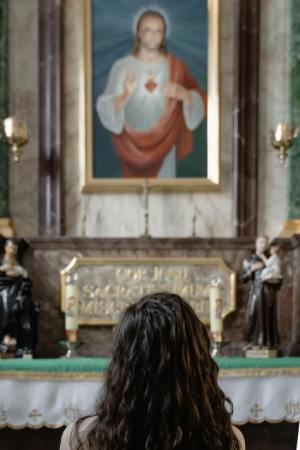 Woman Praying at Altar